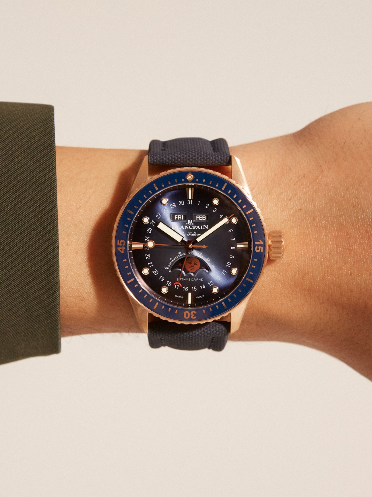 Blancpain Fifty Fathoms Bathyscaphe watch with navy dial and black strap on wrist.