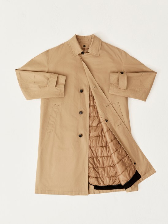 Beige trench coat with quilted lining visible, laid flat showing both exterior and interior details