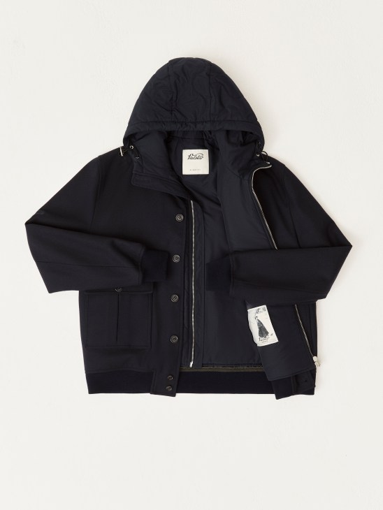 Navy hooded jacket by Valstar laid flat on white background, showing front zipper and button closure details