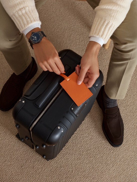 Travel outfit with luxury suitcase, menswear, watch and luggage accessories for the sophisticated traveler