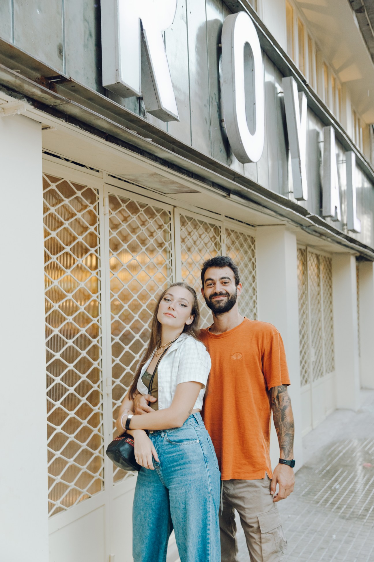 Young couple posing together outside Cinema Royal building in Beirut