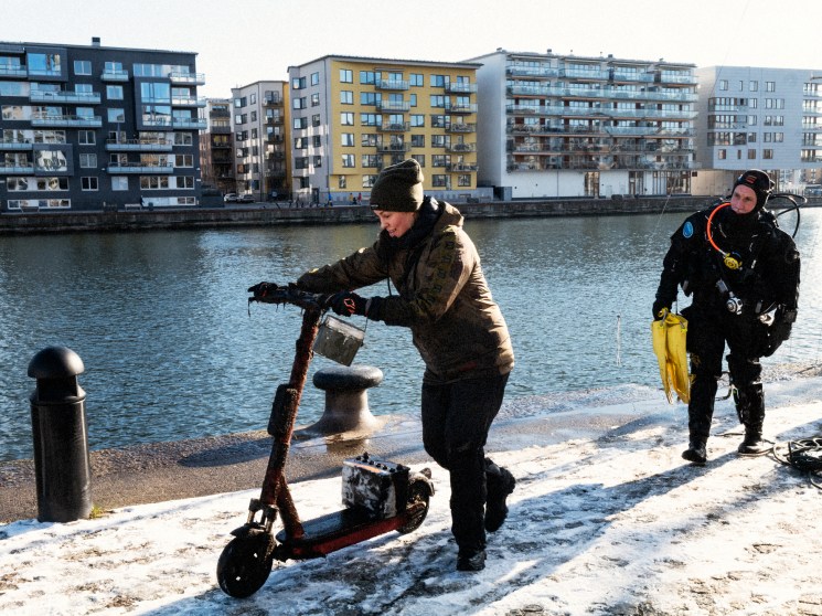 Damaged and waterlogged e-scooter retrieved from the bottom of the canal