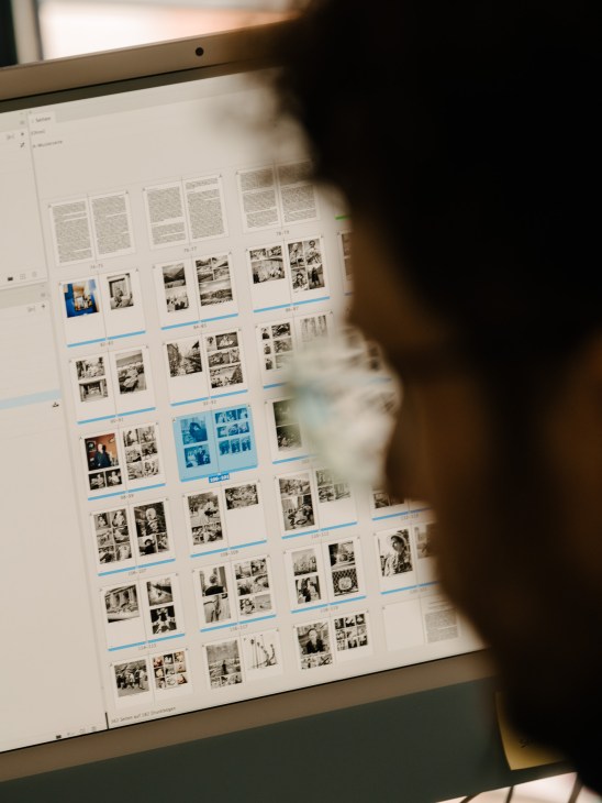 Quality control process showing final inspection of printed materials before production