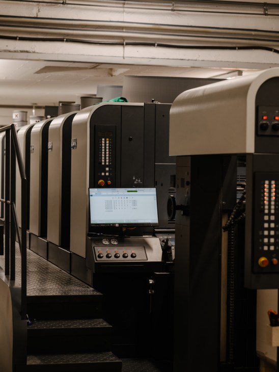 Large industrial Manroland offset printing press machine in Steidl's printing facility