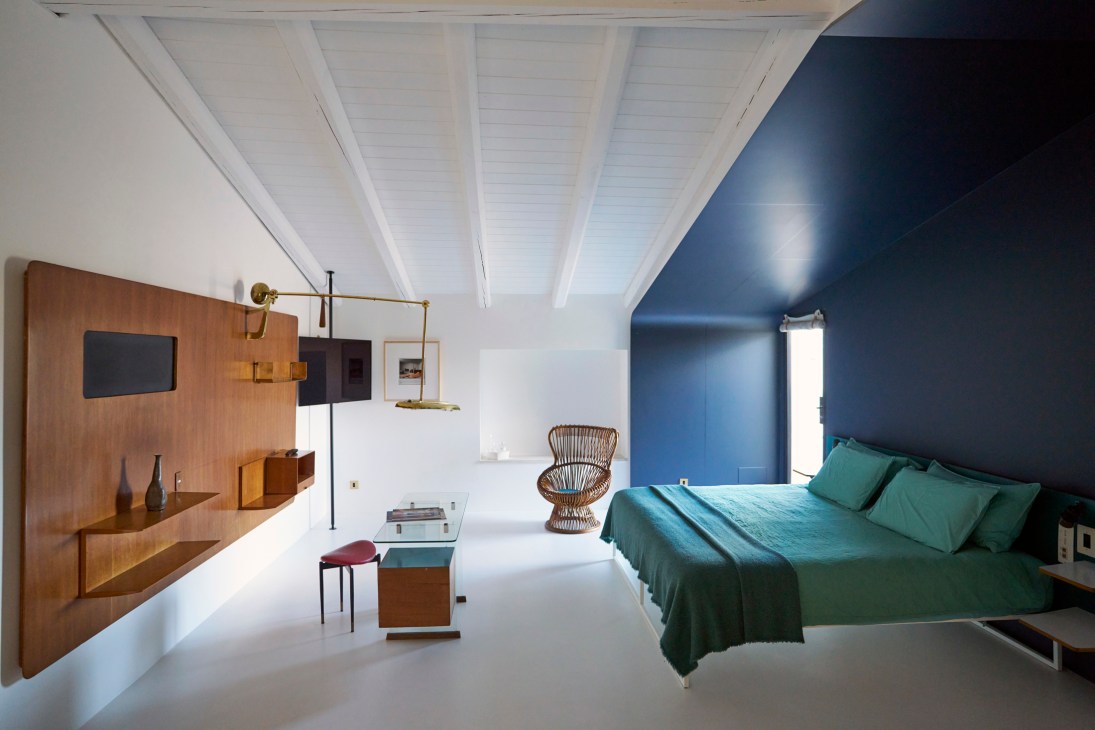 Stylish hotel bedroom with mid-century modern furniture and design elements