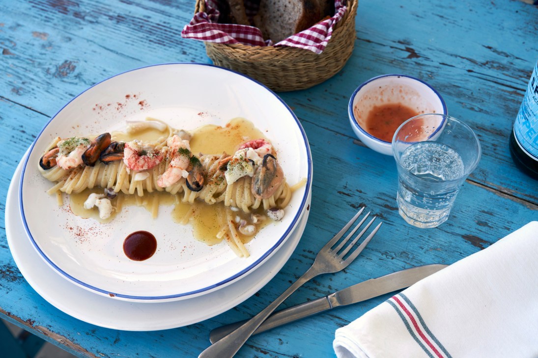 Artfully plated seafood dishes with creative presentation and garnishes