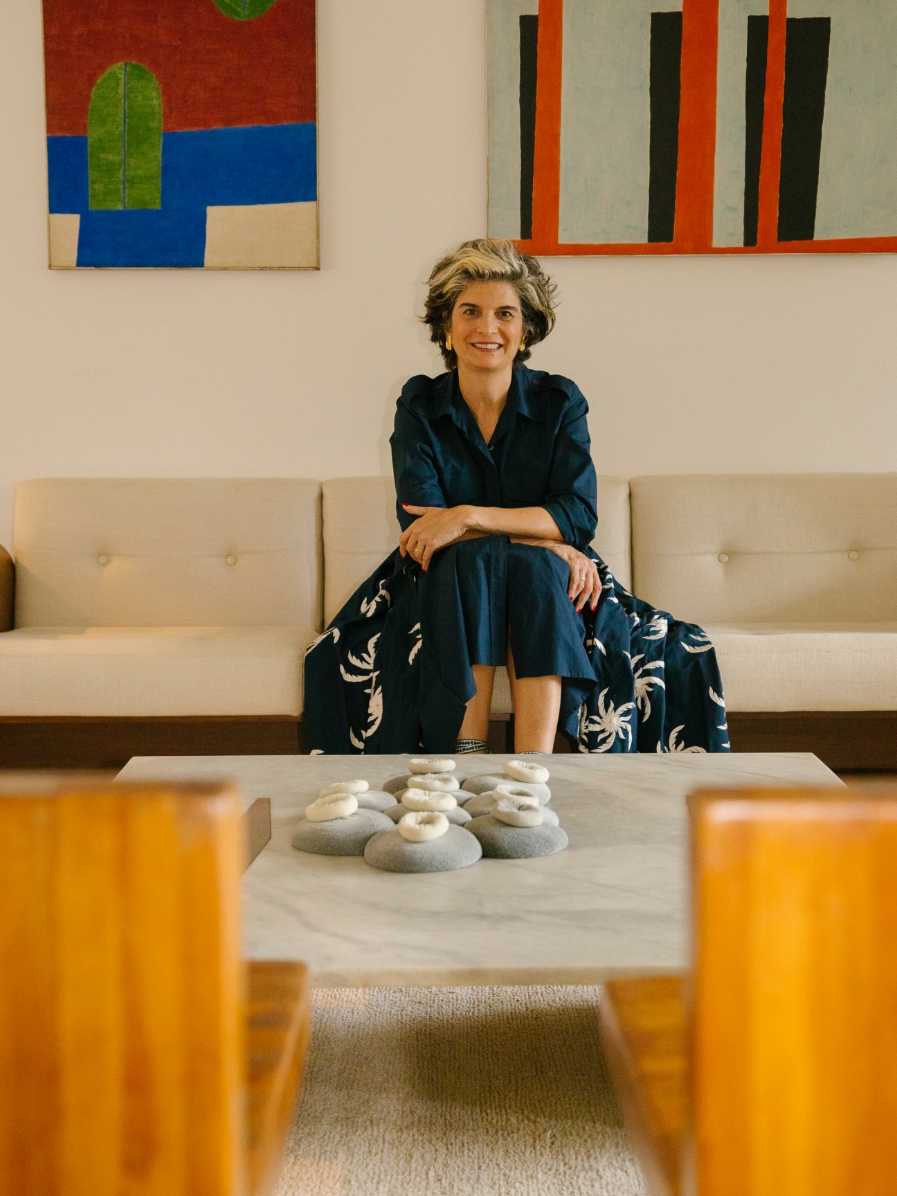 Fernanda Feitosa, founder and executive director of SP-Arte, standing in an art gallery