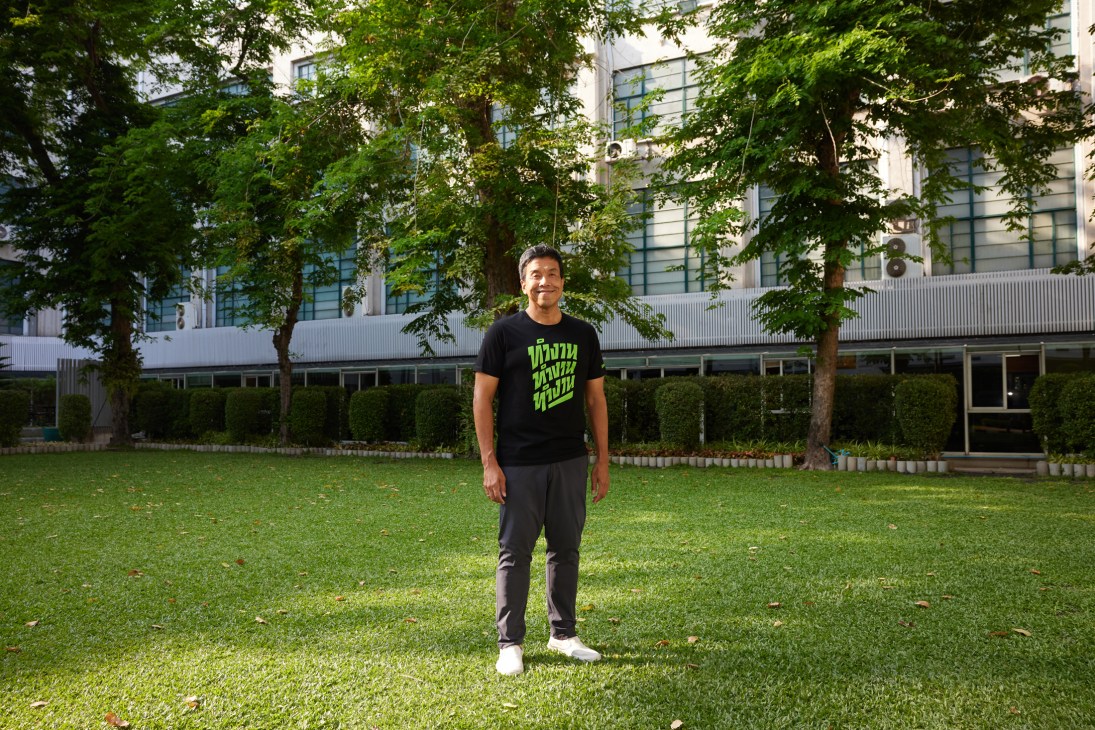 Chadchart Sittipunt, Bangkok's governor, standing in his office at City Hall wearing a black campaign T-shirt