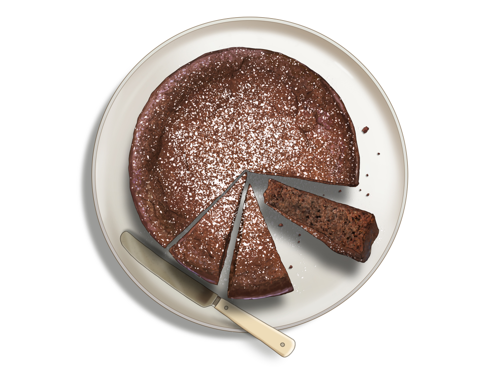 Rich dark chocolate cake dusted with icing sugar on a white plate with whipped cream and rum raisins