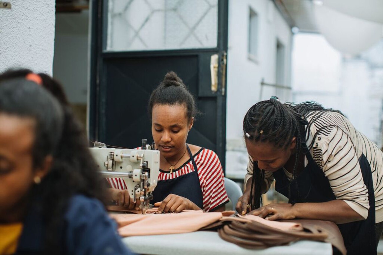 Eyerusalem Kidane working with leather materials in her workshop