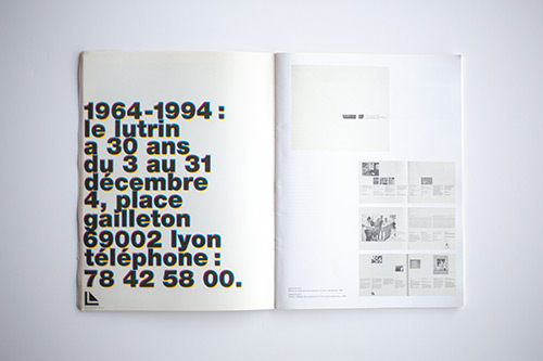 Open publication showing bold black typography on left page and layout spreads on right page.