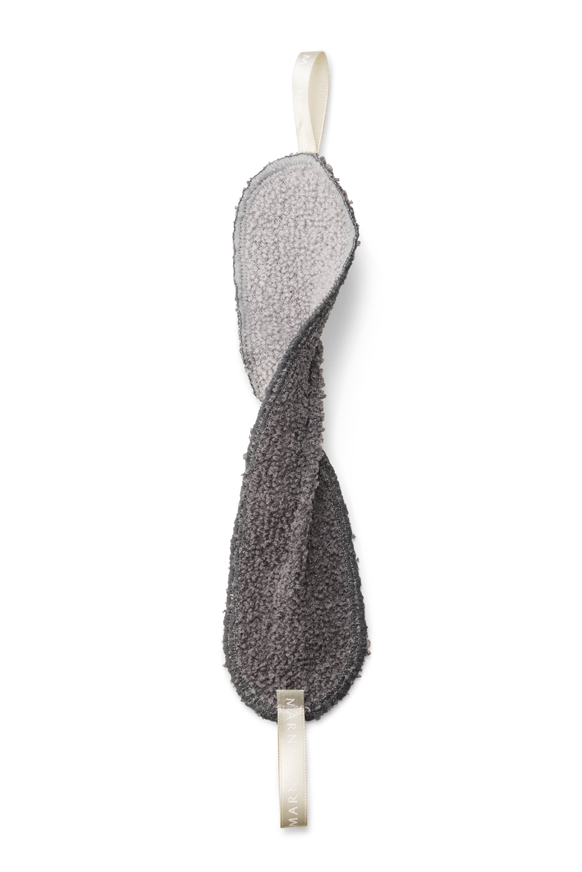 Marna tap-cleaning cloth with cream ribbon and textured gray surface for cleaning faucet backs.