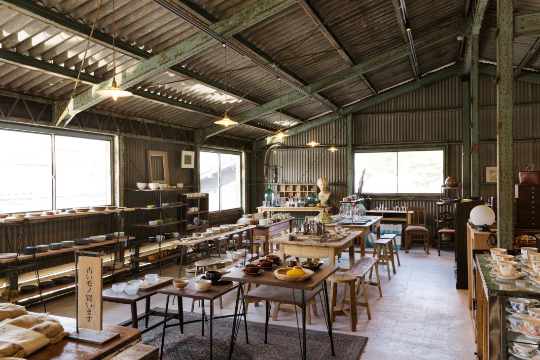 Interior view of renovated warehouse space showing industrial architecture and modern retail setup