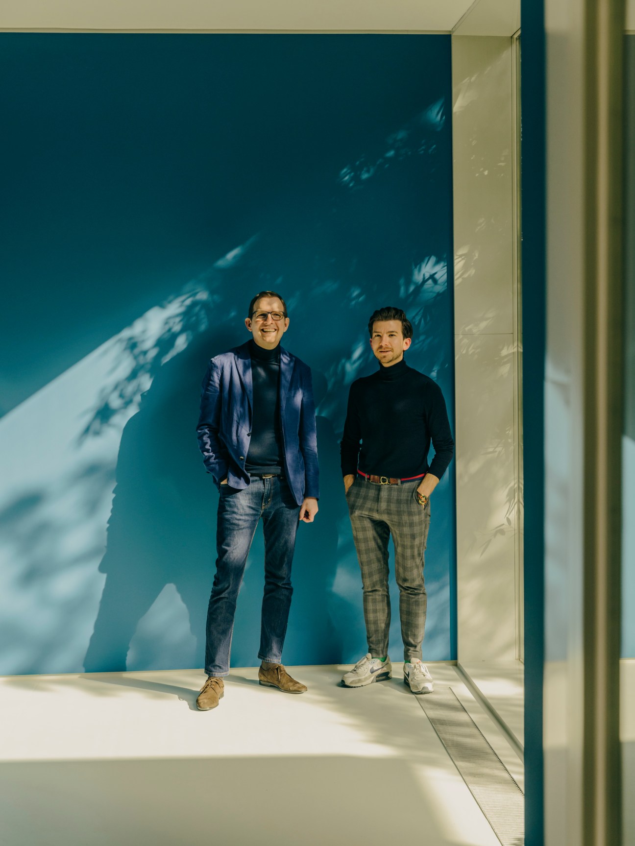 Ralf Kemper and Pay Matthis Karstens standing together in a modern interior space