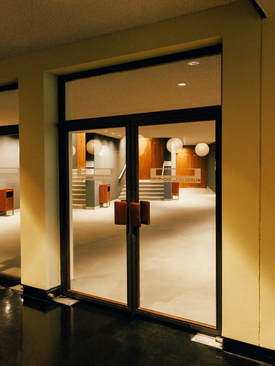 Spacious lobby area of the Deutsche Oper showing modernist architecture and design