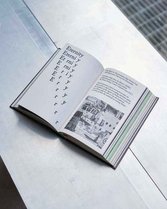 An open book with the word Eternity repeating across the page, losing a letter in each row until at the bottom of the page only the r is left