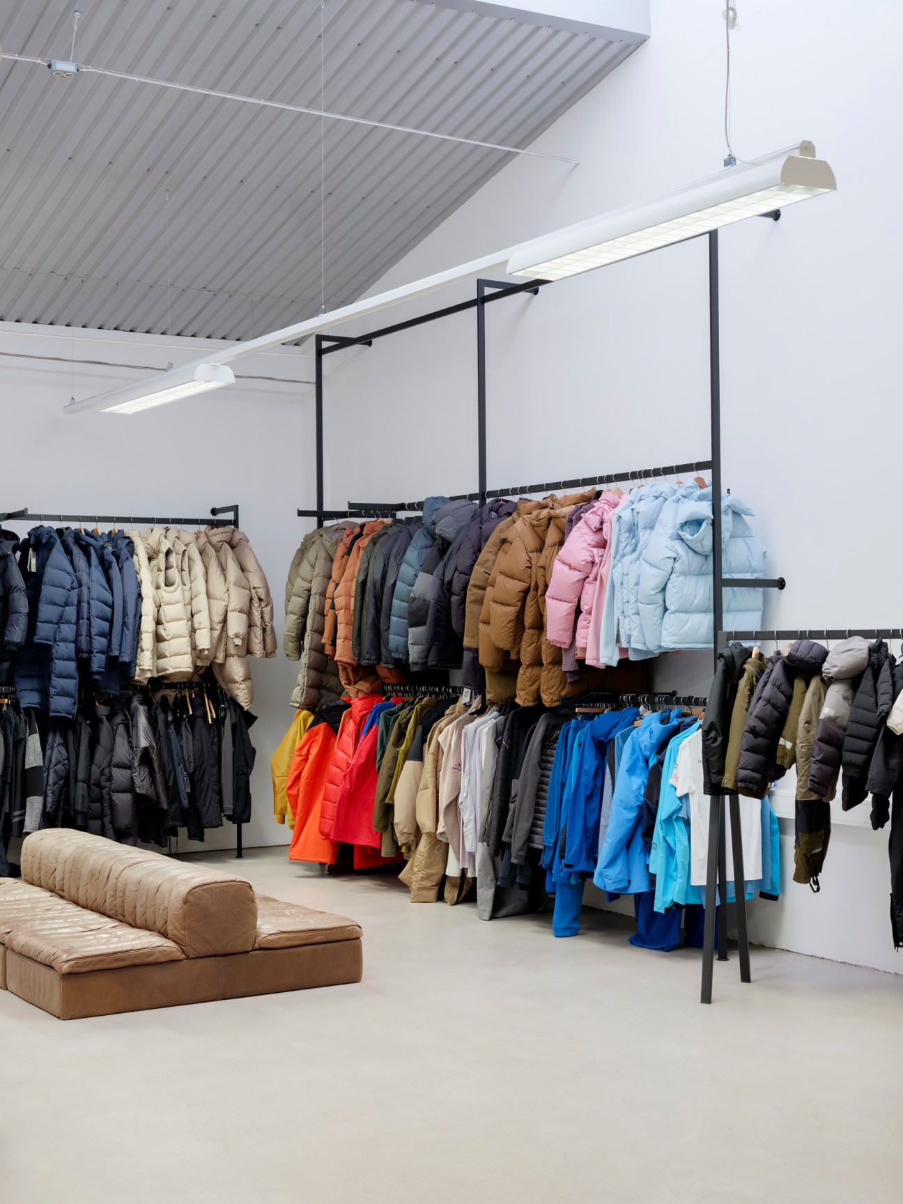 Interior view of 66°North's modern showroom displaying jackets and outerwear