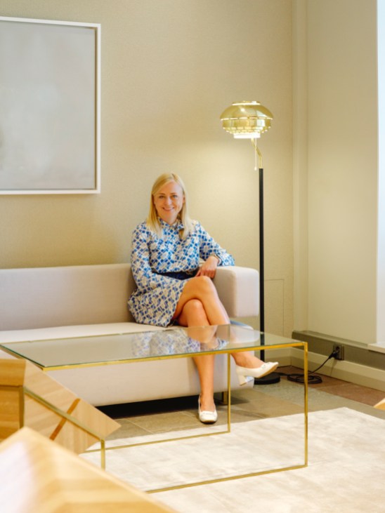 Portrait of Finnish Foreign Minister Elina Valtonen seated in an official government setting