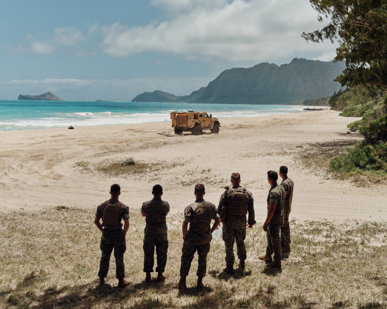 Marines training in joint light tactical vehicles on Bellows Beach, Oahu