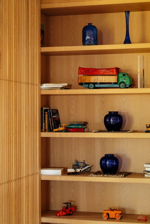New wooden shelving installation in the renovated apartment