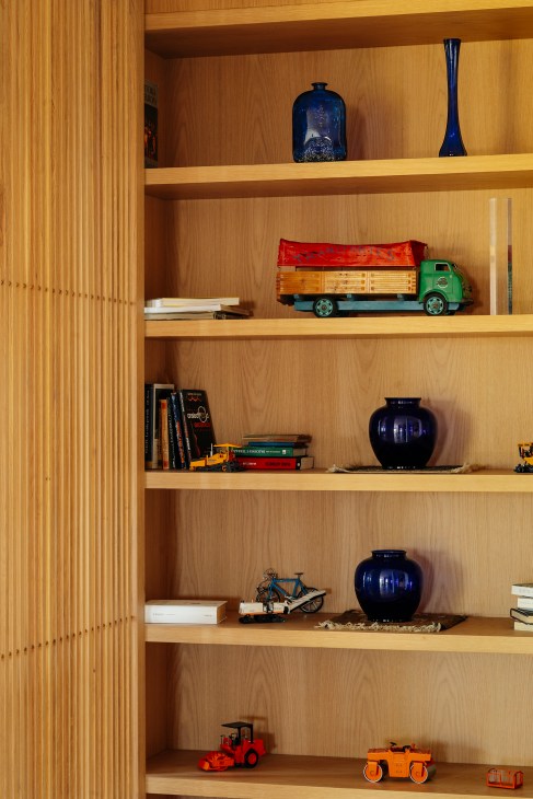 New wooden shelving installation in the renovated apartment