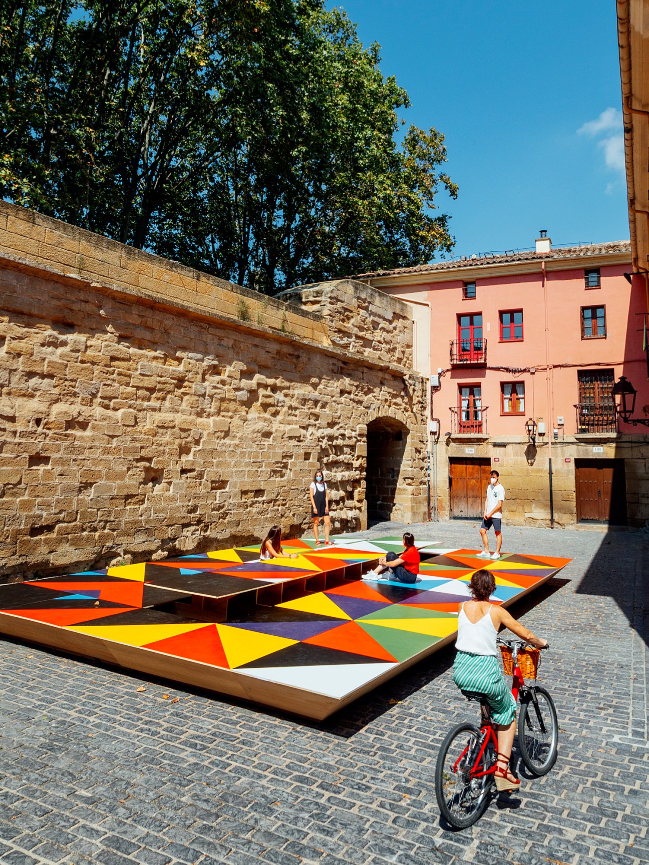 Colorful geometric installation called Fiesta by architects Attila Kim and Bogdan Ciocodeica in an urban plaza
