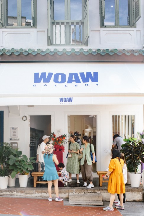 WOAW Gallery Singapore shophouse exterior with visitors gathered outside the heritage building entrance