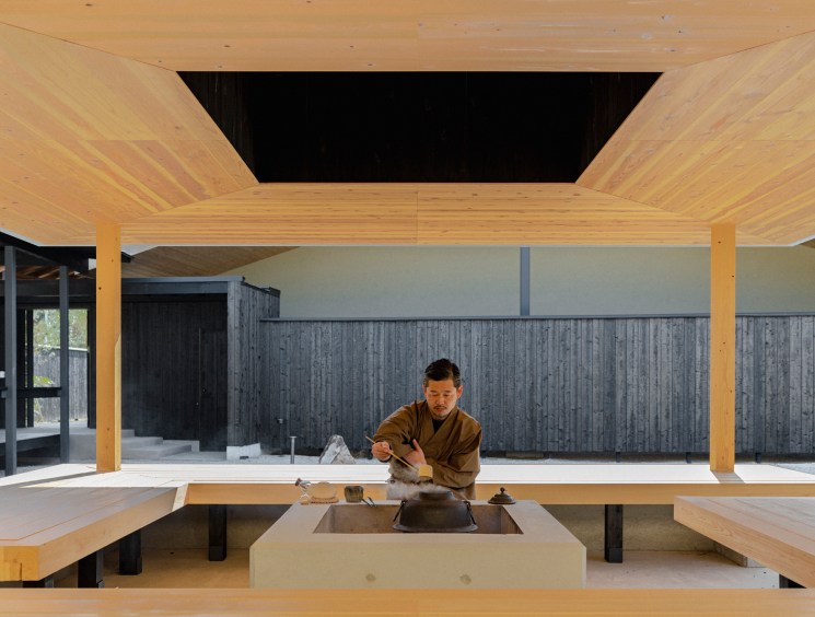 Roka owner Shintaro Sasaki performing tea ceremony in traditional Japanese interior with wood beams and tatami