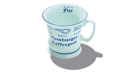 Light blue porcelain mug with blue text reading 'Hamburger Kaffeepott' and nautical design elements.