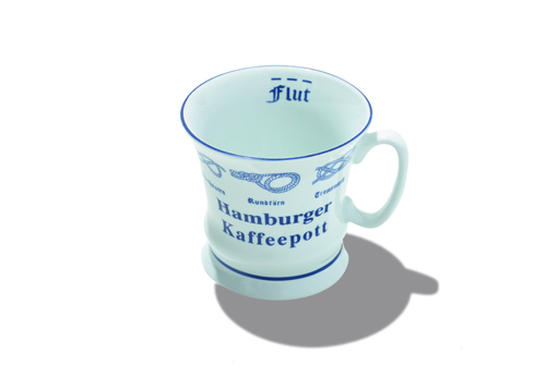 Light blue porcelain mug with blue text reading 'Hamburger Kaffeepott' and nautical design elements.