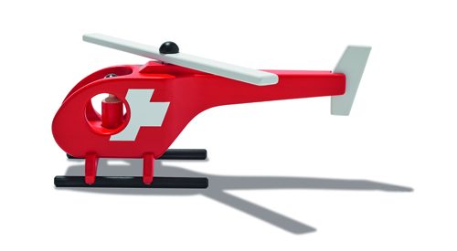 Red wooden toy helicopter with Swiss flag emblem by Schweizer Heimatwerk.