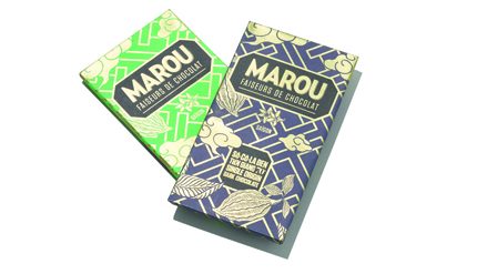 Two Marou artisan chocolate bars with green and dark blue packaging featuring gold lettering.