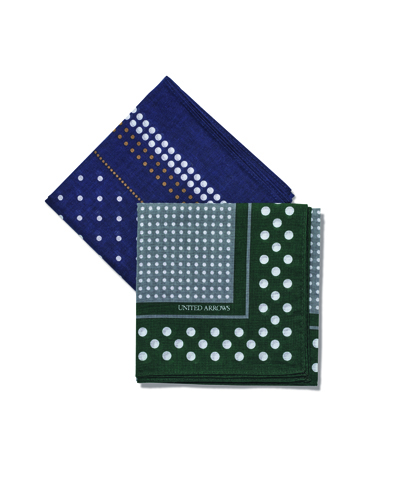 Three folded handkerchiefs with white dot patterns on navy, gray, and dark green backgrounds.