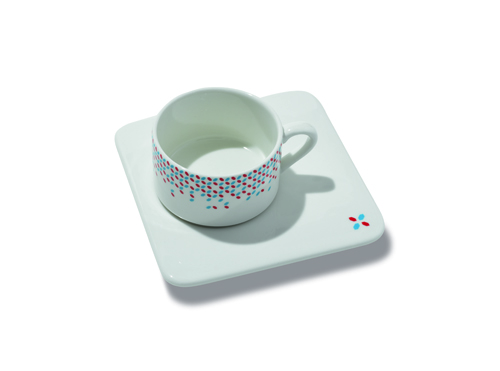 White ceramic teacup and coaster decorated with Luxembourg's flag colours.