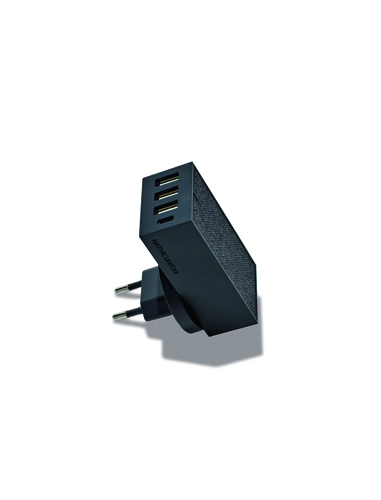 Native Union multi-USB wall charger with black casing and interchangeable plug adapters.