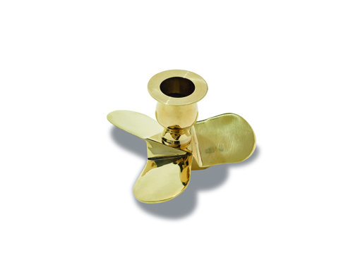 Brass propeller-shaped candlestick with three blades and cylindrical holder on white background