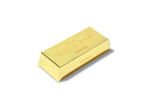 A gold-coloured rectangular bar with embossed text reading 'GOLD BAR'.