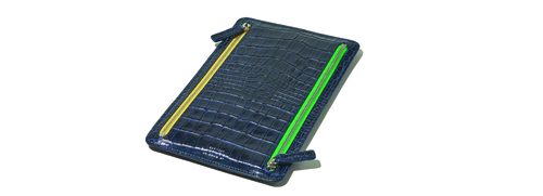 A dark blue solar-powered charging pad with yellow and green accents.