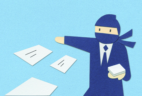 Business figure in blue suit pointing at scattered white cards or documents on blue surface