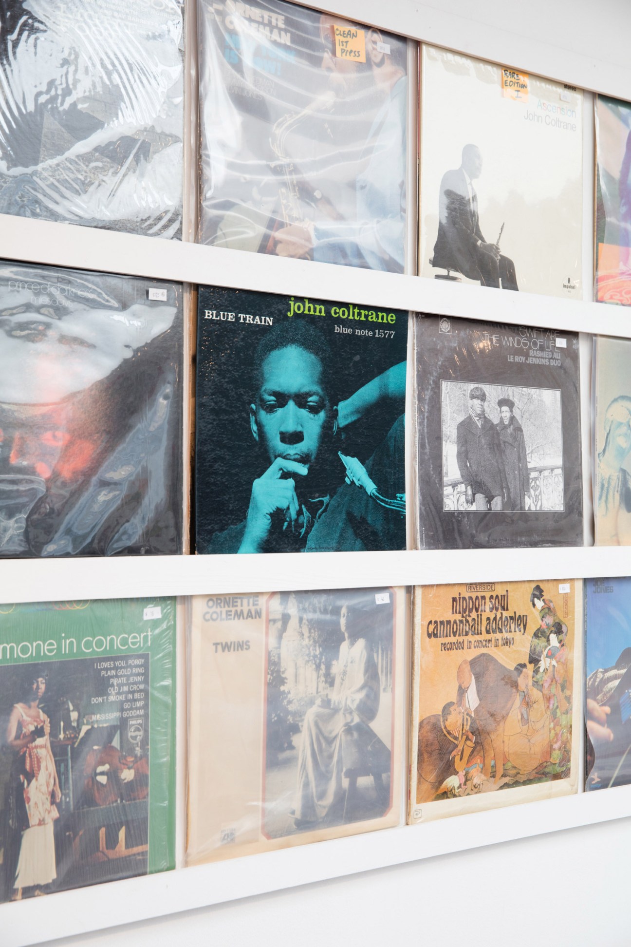 Interior of Cosmos Records showing rows of vinyl records organized in bins
