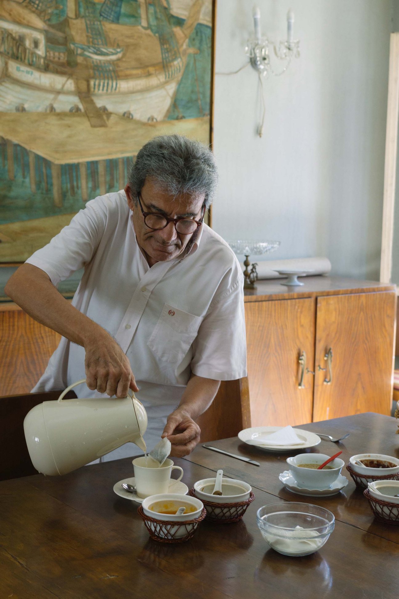 Jamil Azar, owner of Dar al Achrafieh, pouring traditional Lebanese breakfast tea into a cup.