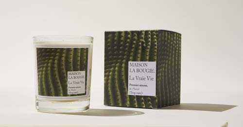 Maison La Bougie scented candle with La Vraie Vie label and matching patterned box.