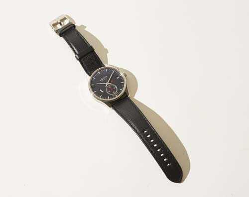 Leica L1 wristwatch with stainless-steel case, black dial, and dark leather strap.