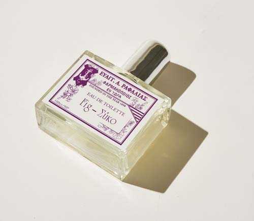 Rafalias fig perfume bottle with purple label and gray cap on white background.