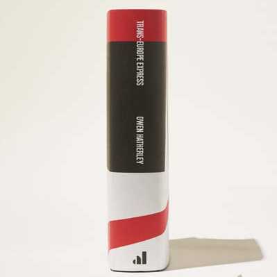 Catamount bourbon bottle with red and white stripe design and black label.