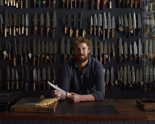 Tom Saunders in Kitchen Provisions shop in London displaying Japanese knives and kitchen tools