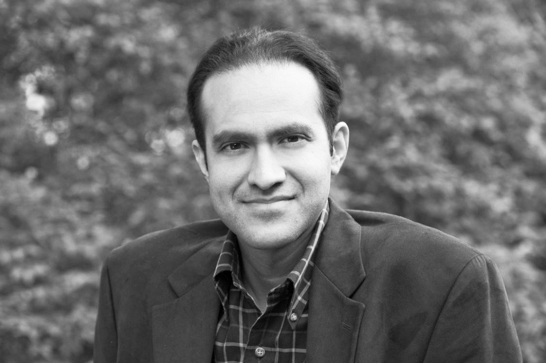 Black and white portrait of Saleem H Ali, associate professor of environmental studies at University of Vermont.