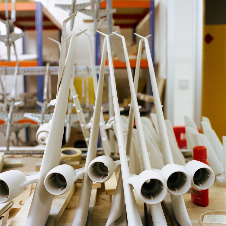 Close-up of white resin aircraft engine models being crafted at Curvature Group's London studio.