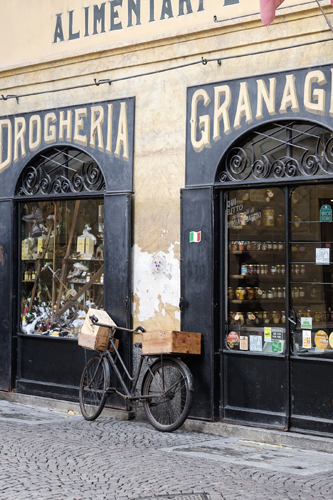 Interior of Ciapponi grocery store in Morbegno showing traditional wooden shelves and Italian products