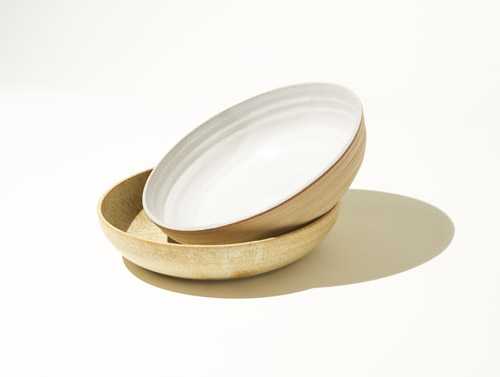 Two stacked ceramic bowls with muted natural glaze by Lazy Eye Ceramics.